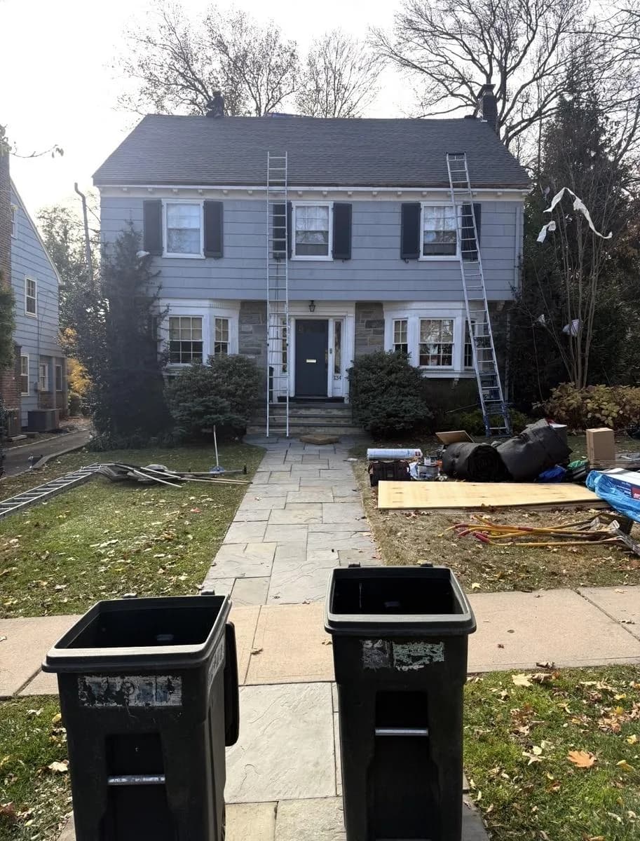 Front elevation of Montclair colonial home with new GAF Timberline HDZ Charcoal roof