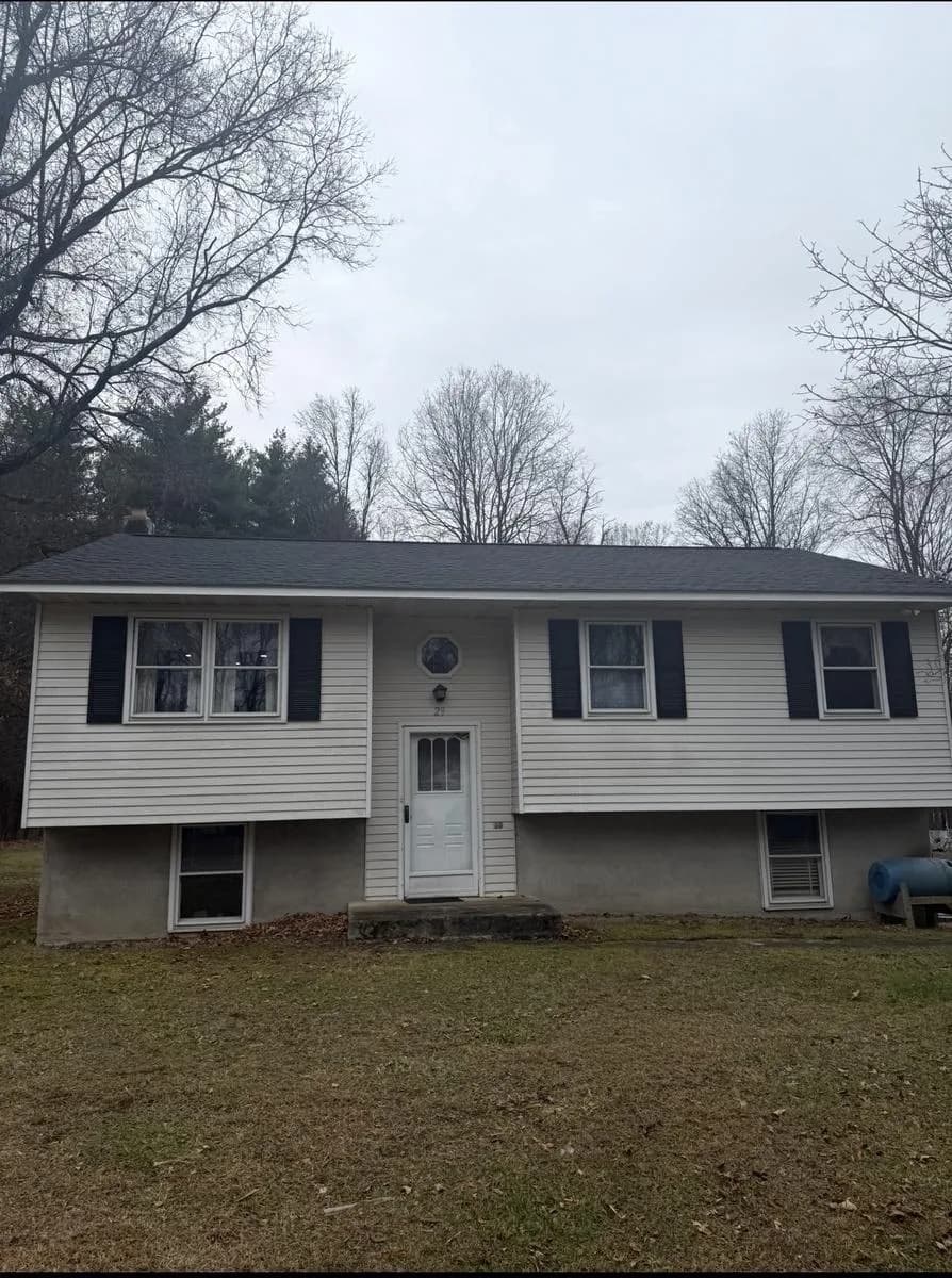 Front elevation of split-level home with new GAF Timberline HDZ Charcoal roof — Wallkill, NY