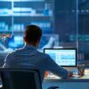 a focused office environment showcases a professional seated at a sleek desk, meticulously comparing vibrant roof repair quotes spread out on a digital tablet and printed documents, illuminated by clear overhead lighting that emphasizes the detail and clarity of each proposal.